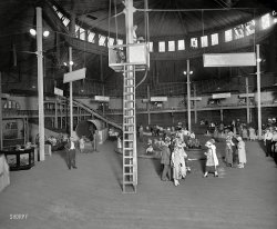 The Glen Echo amusement park fun house in Maryland circa 1925. Our second look at these silly signs. National Photo Company glass negative. View full size.
