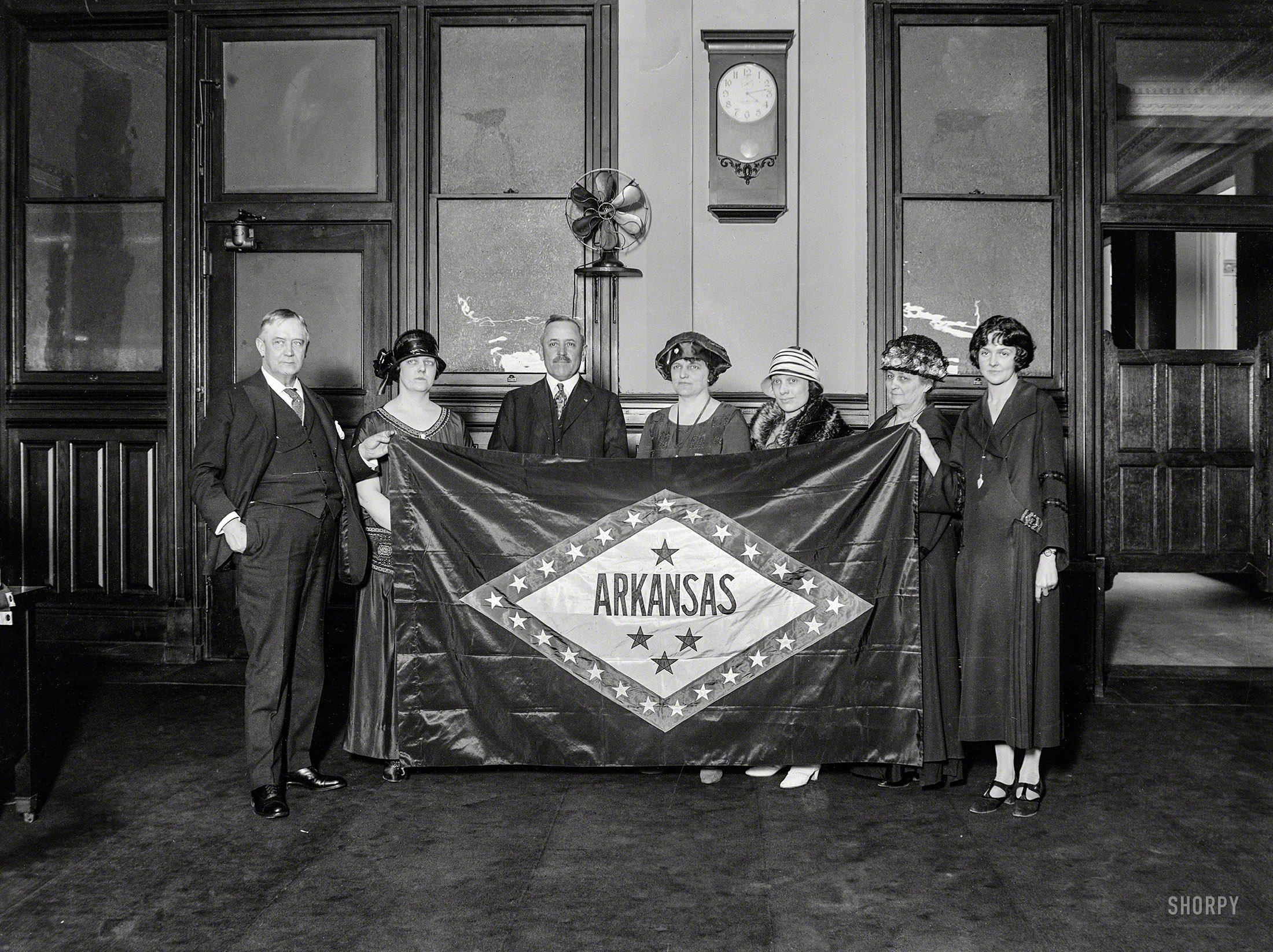 April 1924. Washington, D.C. "Group holding Arkansas state flag." Regnat populus! Harris & Ewing Collection glass negative. View full size.