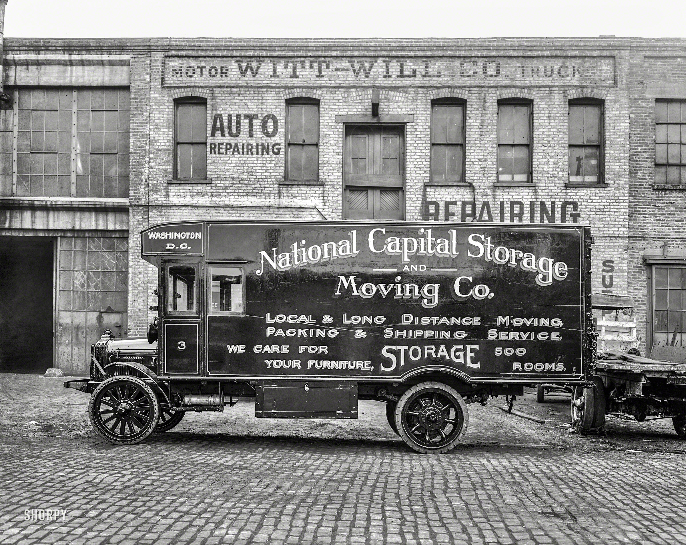 Washington, D.C., circa 1926. "National Capital Storage & Moving Co." At 52 N Street N.E., the Witt-Will motor truck garage last seen here. This older-generation van wears solid rubber tires, acetylene-gas headlamps and at least one repaint. 8x10 inch glass negative, National Photo Company. View full size.