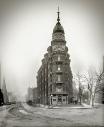 Washington, D.C., circa 1917. "Portland Apartments, 14th Street &amp; Thomas Circle." Mold on the emulsion lends an eerie aura to this already spooky-looking structure (also seen here). National Photo Company Collection glass negative. View full size.
Poor Man&#039;s Flatiron Looks like a wannabe Flatiron Building complete with cigar store in the point.
More like twenty tedious minutes in Managua...Courtesy of Cigar Aficionado:
In his youth, Groucho Marx was too poor to smoke anything but nickel cigars. Only once before he came into big money did he loosen up enough to spend a dime for one. This was the result of an advertisement he had seen for a brand of ten cent pure Havanas called La Preferencias. The ad fascinated him, for it promised the smoker "Thirty glorious minutes in Havana." 
Groucho returned it because it only lasted twenty.
Demon MoldHere we see not just mold but evidence of a counterattack -- wash streaks where someone scrubbed the plate with a rag. (Which in my experience works pretty well, but hard to do without losing emulsion.)
All that&#039;s there nowIs this tired-looking Residence Inn.
Cool!I want to live there.
Street View BluesWhenever you guys post present day street view scenes, I find it incredibly upsetting. Man oh man does progress suck.
Lost gloryOnce-beautiful Thomas Circle is now surrounded, except for two churches, by hideous office buildings.
1880-1962The Portland ended life as an office building. Its fifteen minutes of fame came in 1922, in a four-alarm fire that started in Senator Kenneth McKellar's apartment. Having sunk into decrepitude over its many years, the place was torn down in 1962.
WonderfulI love this building.  It even has stained glass windows.  I would live there.  Too bad there is nothing left of such a grand building except this photograph.  
(The Gallery, D.C., Natl Photo)