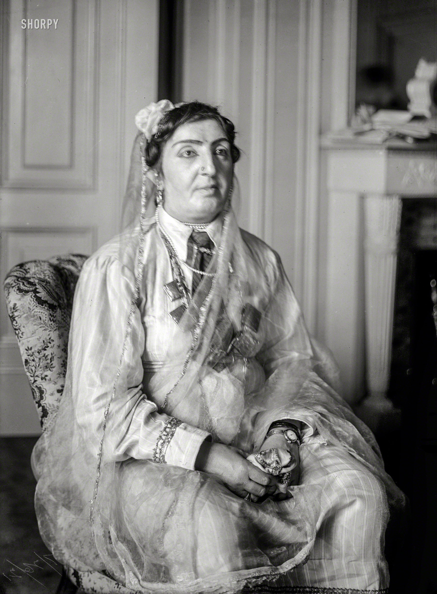 July 1921. New York. "Princess Fatima Sultana of Afghanistan." The "princess," whose claim to royalty was questionable, met with President Harding in Washington after a notorious impostor named Stanley Weyman (among other aliases), pretending to be a "naval liaison," tricked the State Department into arranging the interview. 8x10 glass negative, Bain News Service. View full size.
&nbsp; &nbsp; &nbsp; &nbsp; The princess, it was learned, takes out her nose jewel when she goes to bed at night, as other women remove their earrings. Unlike American women, she is not afraid of rats, mice, or bats. The reason for this immunity from those customary feminine fears is that in the Mohammed religion, which she professes, not only cats but all animals are sacred. (Washington Post)