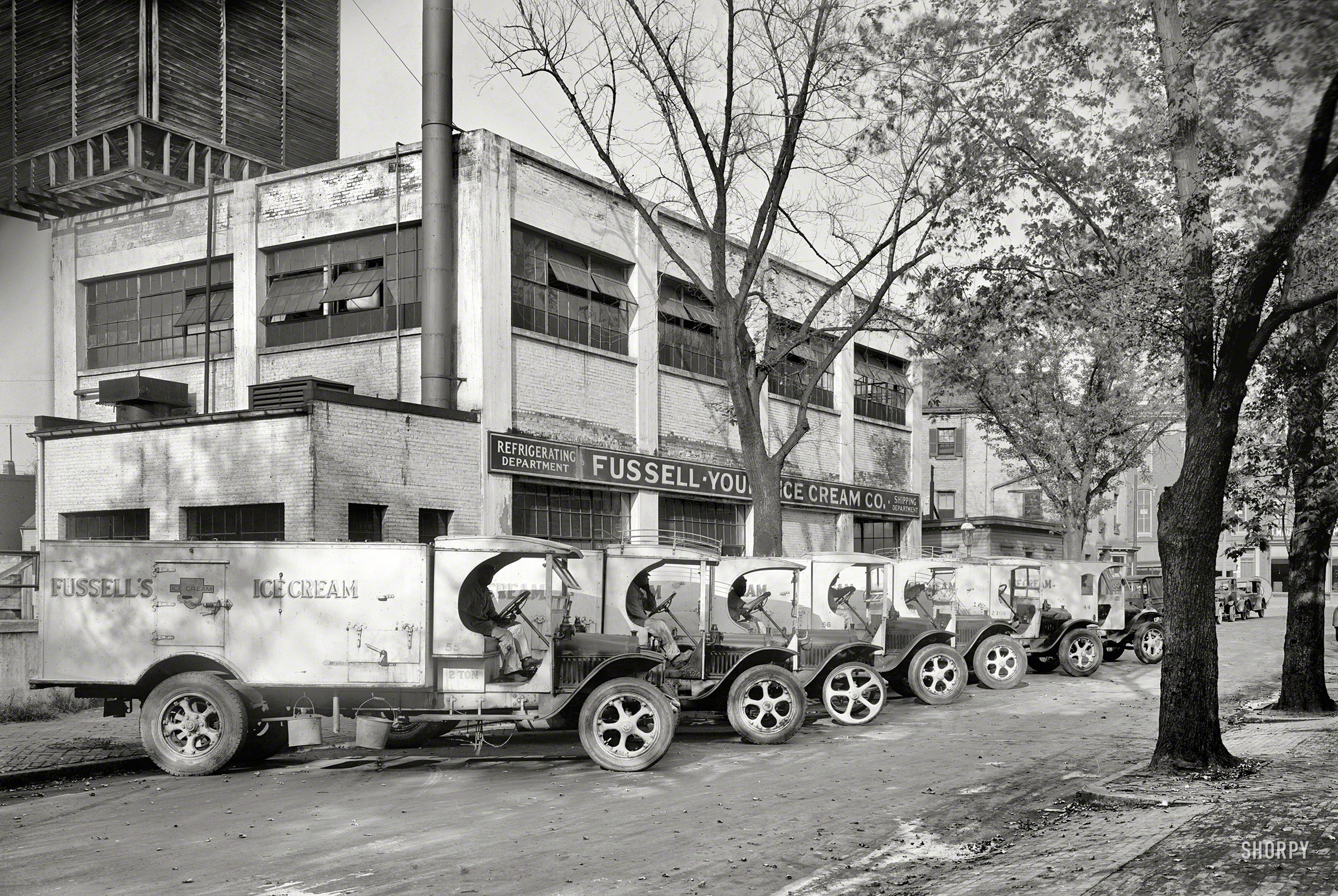 Washington, D.C., circa 1928. "Fussell-Young Ice Cream Co. trucks." Harking back to the days when ice cream was local. 8x10 inch glass negative. View full size.