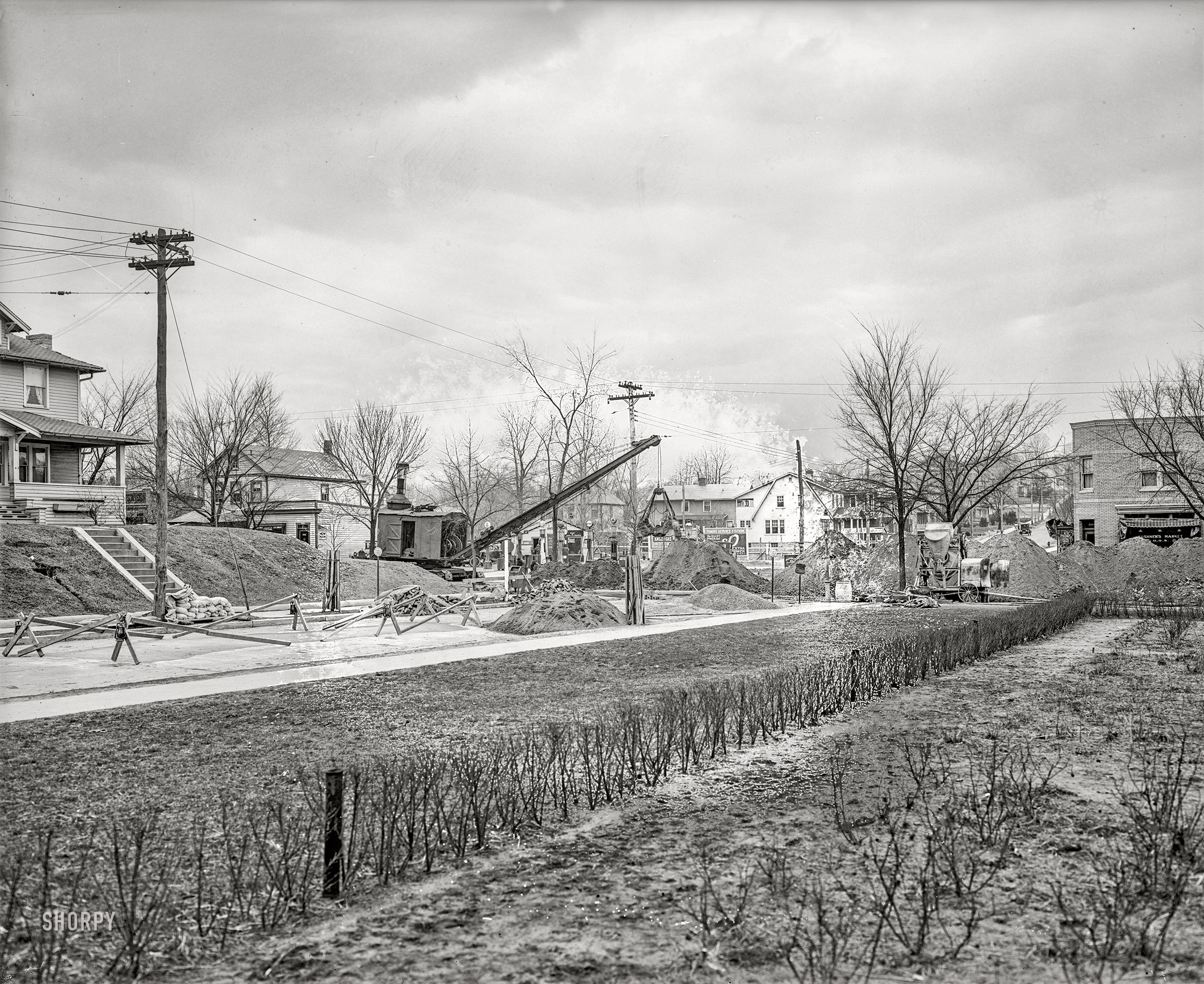 Washington, D.C., circa 1926. "S.W. Barrow," the caption on this National Photo glass negative, name-checks District real estate developer Samuel W. Barrow, who may have had something to do with this work near his home on Monroe Street N.E. (a neighborhood last seen here) at the intersection with 18th. Note the gas station in the background. View full size.