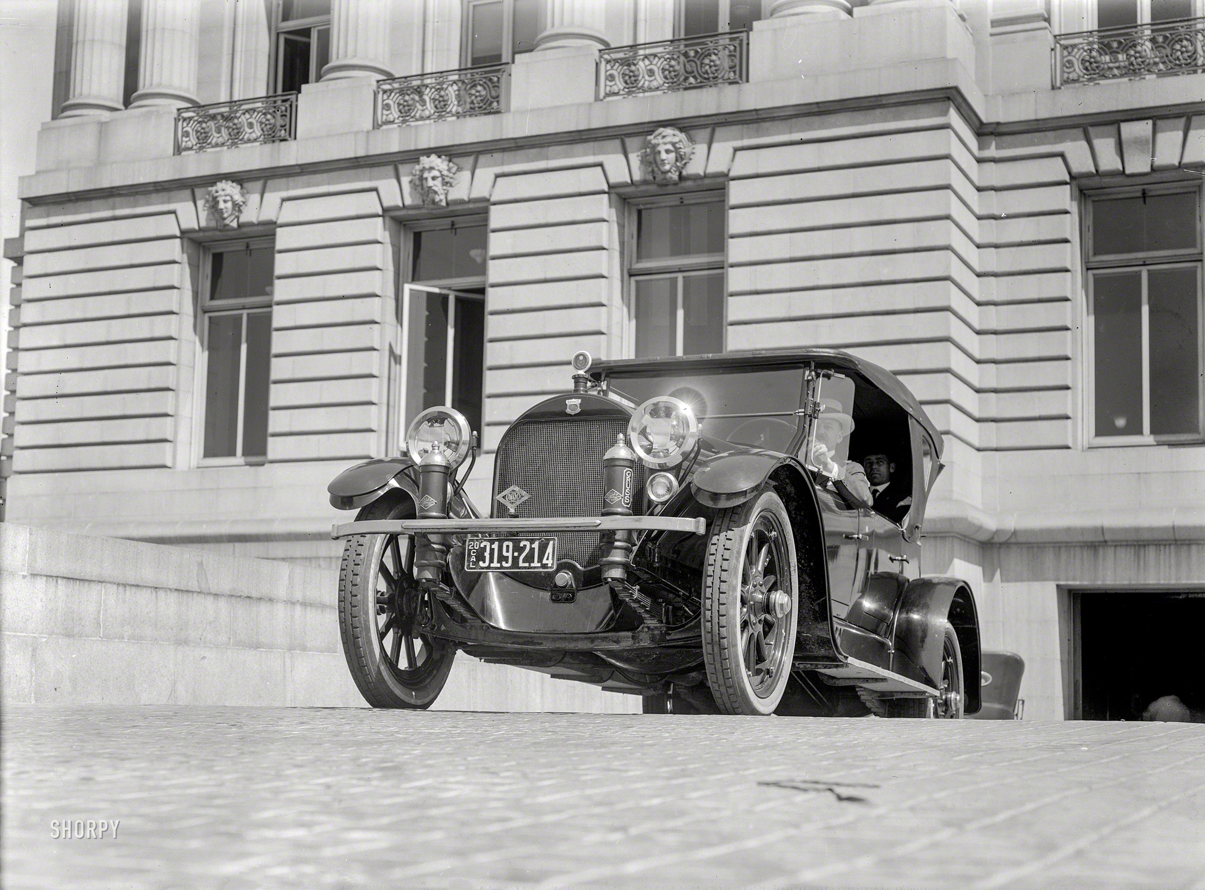 San Francisco, 1920. "Haynes touring car leaving garage." Riding on Gruss Air Springs. 5x7 glass negative by Christopher Helin. View full size.