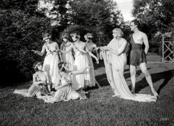 Denishawn dance company founder Ruth St. Denis and husband Ted Shawn with garden party guests (bridesmaids? caterers? vestal virgins?), among them the modern dance pioneers Louise Brooks and Martha Graham. View full size.