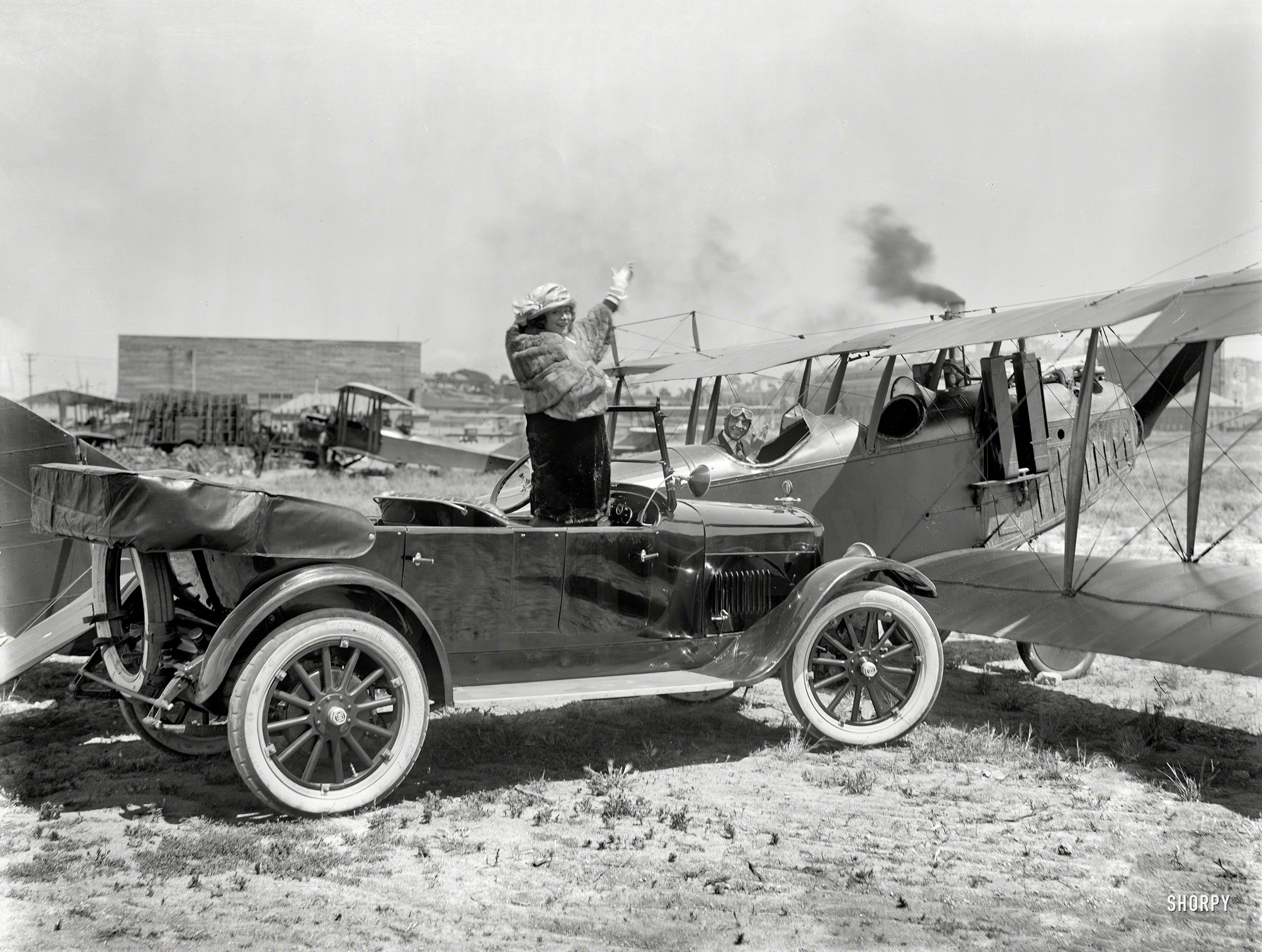 San Francisco circa 1920. "Studebaker touring car and biplane at airfield." With the fur possibly about to fly. 6½ x 8½ inch glass negative. View full size.