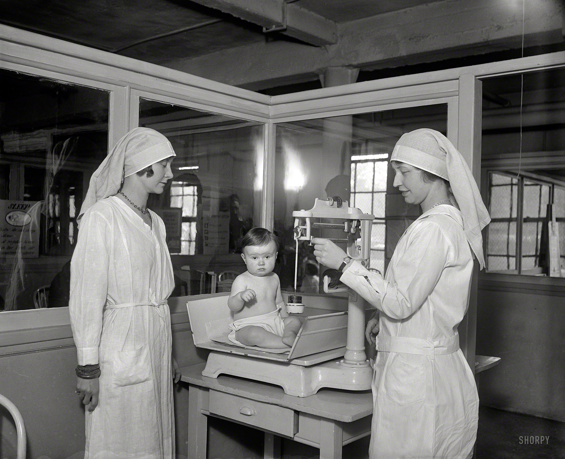 March 1930. Washington, D.C. "Junior League members at Children's Hospital." Baby's first word: Meh. Harris & Ewing Collection glass negative. View full size.