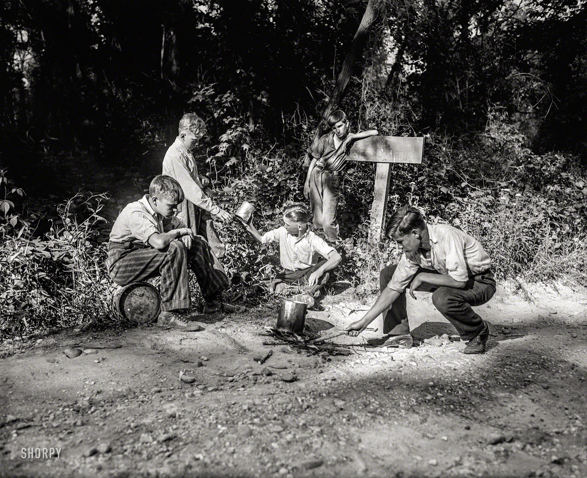 Washington, D.C., or vicinity in 1932. "NO CAPTION (boys cooking over camp&shy;fire next to NO TRESPASSING sign)." Possibly friends with these lads, or at least neighbors in this sequence of Harris & Ewing negatives. View full size.