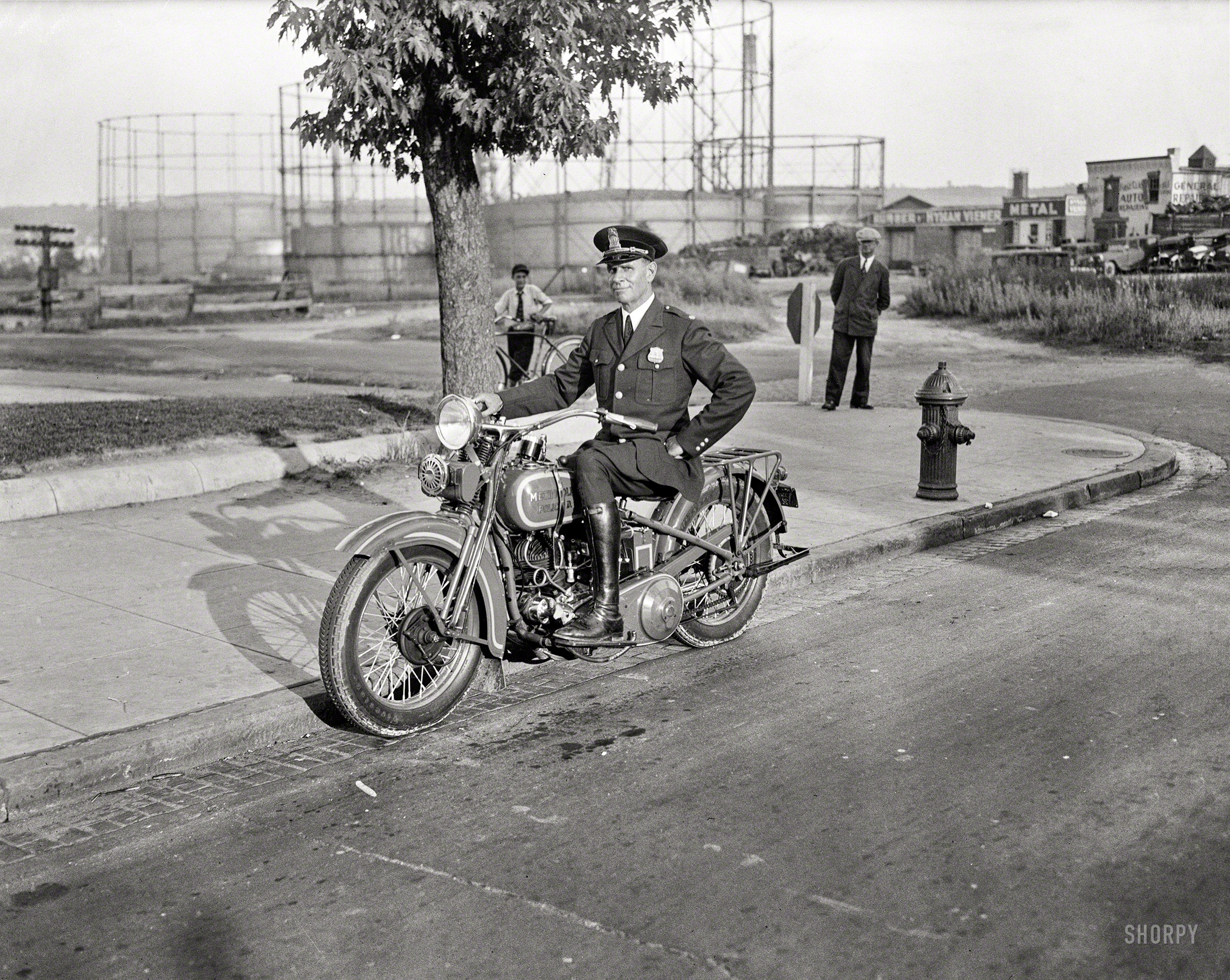 Washington, D.C., 1932. "Metropolitan police officer on motorcycle." Keeping the peace in the gashouse district. Harris & Ewing glass negative. View full size.