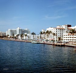 1964. "Miami Beach from Indian Creek." The Fontainebleau Hotel at left. Medium format color transparency, photographer unknown. View full size.
Olds, Pontiac, Chevy, oh my!Seems Miami Beach prefers GM vehicles.
I see a couple Ramblers and a lot of Falcons and a few other Fords, but the majority seem to be GM product.
Goldfinger?This looks an awful lot like the Miami Beach location that kicks off GOLDFINGER (1964) or very close to it.
[There's a reason for that. -tterrace]
(The Gallery, Kodachromes, Cars, Trucks, Buses, Florida, Found Photos, Miami)