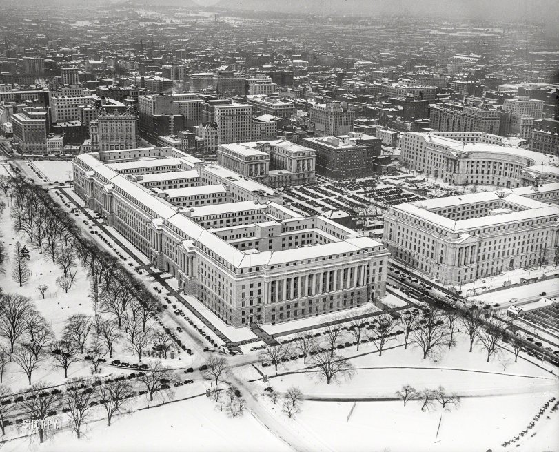 1934. "Aerial view, Federal Triangle in snow, Washington, D.C." Anchored by the 1.8 million square foot Department of Commerce on Constitution Avenue, the largest office building in the world when it was completed in 1932. Harris & Ewing Collection glass negative. View full size.