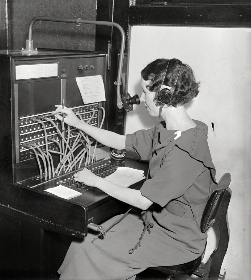 Washington, D.C., 1935. "Woman at Western Electric telephone switchboard." Harris &amp; Ewing Collection glass negative. View full size.
