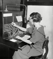Washington, D.C., 1935. "Woman at Western Electric telephone switchboard." Harris & Ewing Collection glass negative. View full size.