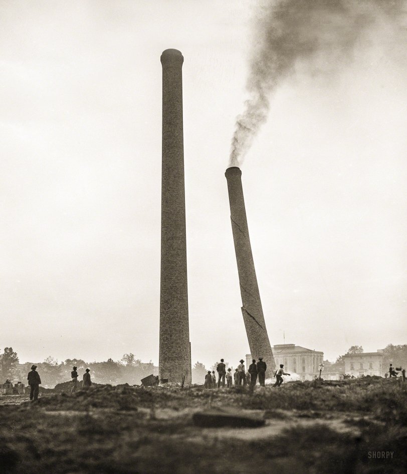 Sept. 17, 1935. "These two 150-foot-tall brick smokestacks on the Mall in Washington, D.C., were considered an eyesore and ordered demolished. The closer stack fell shortly after the far one toppled. They were erected when a central heating plant occupied the site." Harris &amp; Ewing glass negative. View full size.
