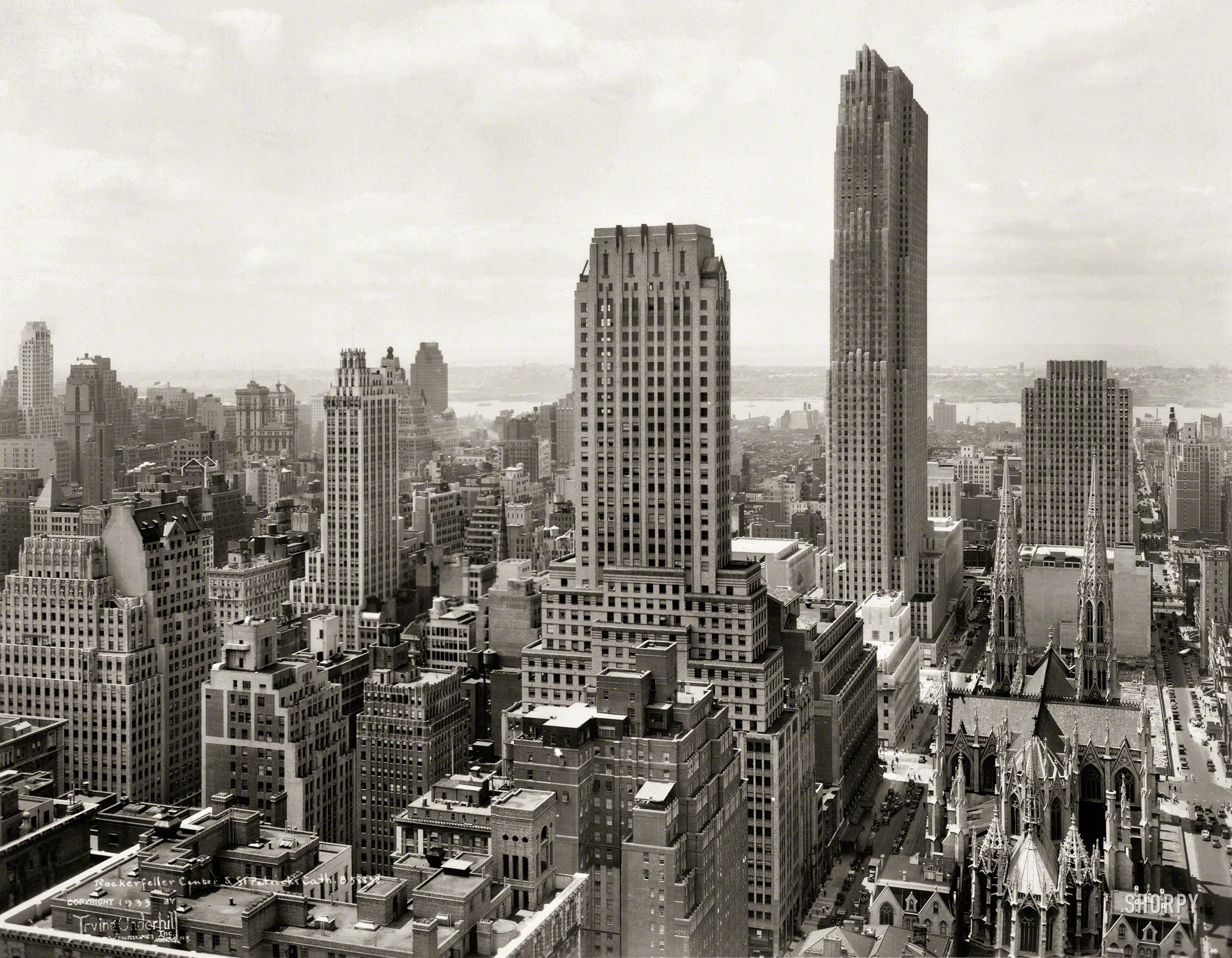 New York, 1933. "Midtown Manhattan skyline -- Rockefeller Center and St. Patrick's Cathedral." Gelatin silver print by Irving Underhill. View full size.