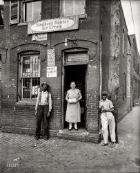Nov. 28, 1935. "Washington, D.C., street scene." One-stop shopping for Wonder Bread, Stud, Prince Albert, ice cream and what-have-you. View full size.