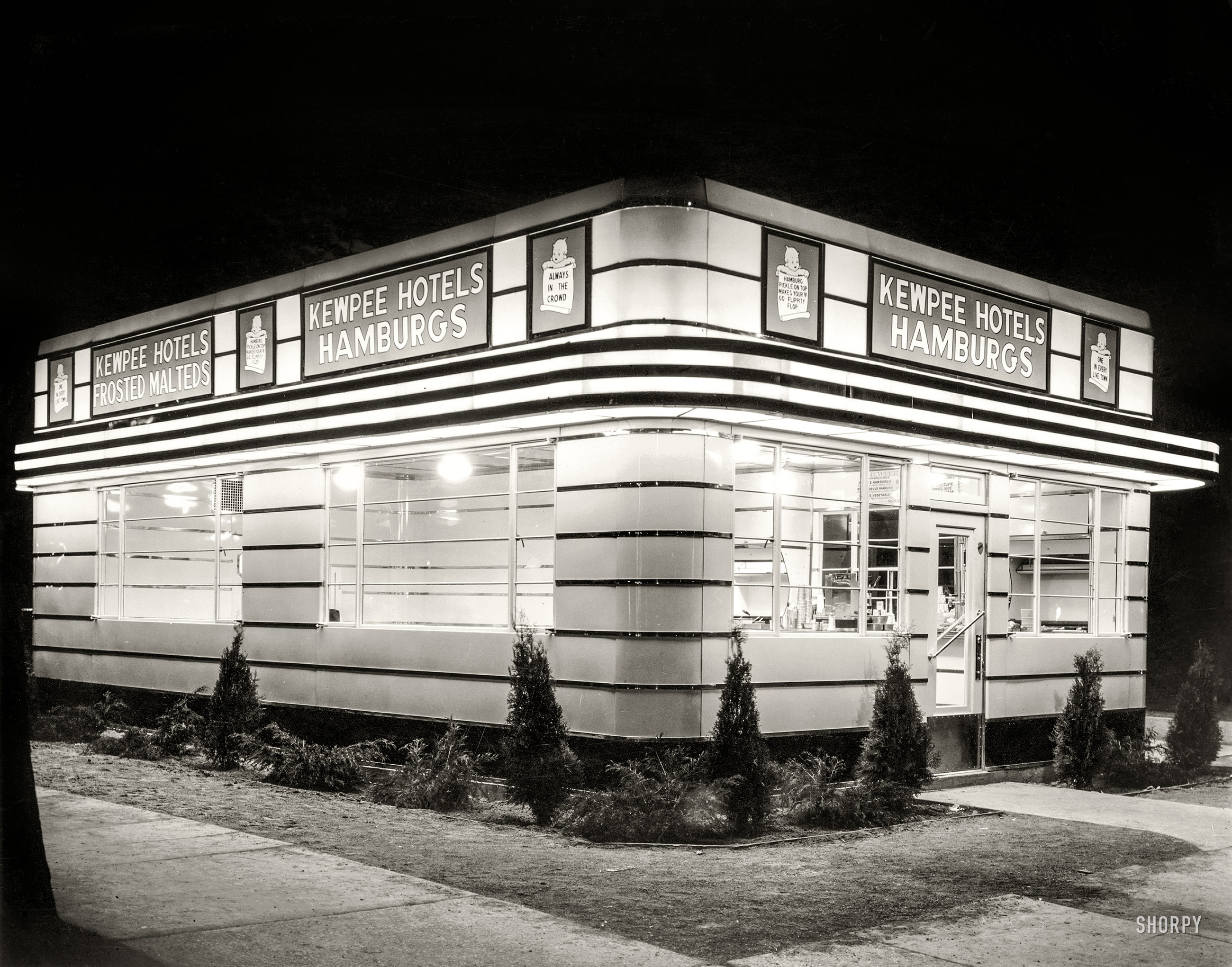 Circa 1930s. "Kewpee Hotels hamburger stand." This early fast-food chain ("Hamburg / Pickle on top / Makes your heart / Go flippity-flop") got its start in Michigan in the 1920s. Location and photographer unknown. View full size.
