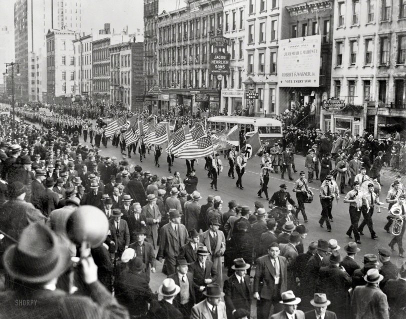 October 30, 1939. "German-American Bund parade on East 86th Street." New York World-Telegram photo (Library of Congress). View full size.
&nbsp; &nbsp; &nbsp; &nbsp; Gerhard Kunze, leader of the German-American Bund, fled to Mexico in November 1941, with plans to evacuate to Germany by submarine. Instead he was captured by federal agents and sentenced to 15 years in prison for espionage; his predecessor, the Munich-born Fritz Kuhn, was arrested, stripped of his citizenship, imprisoned and, after the war was over, deported to Germany, where he died in 1951.
