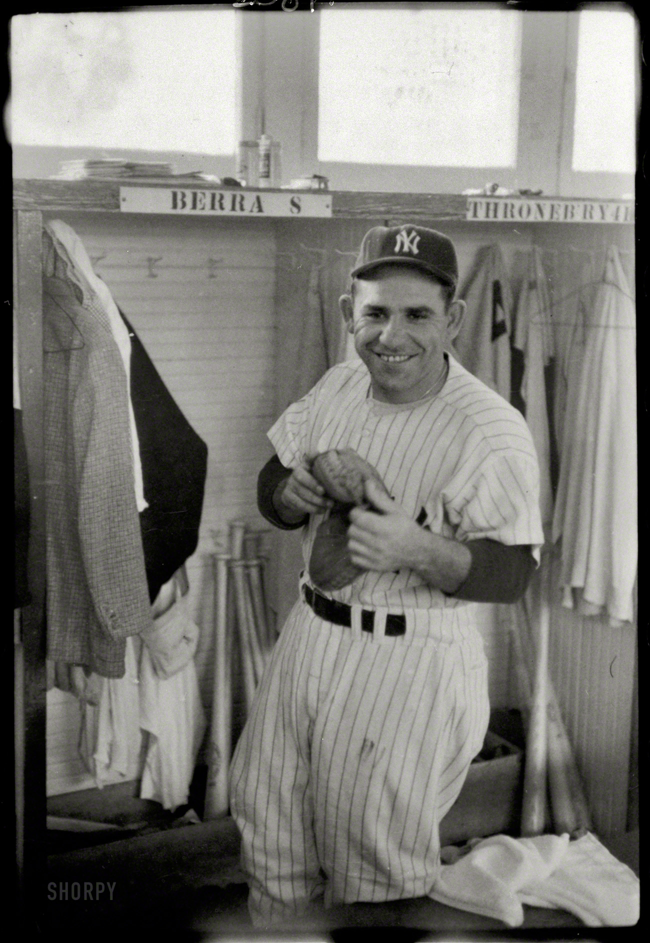 &nbsp; &nbsp; &nbsp; &nbsp; Yogi Berra, Yankees Hall of Fame Catcher With a One-of-a-Kind Wit, Dies at 90
March 20, 1957. "New York Yankees baseball player Yogi Berra, three-quarter length portrait, in uniform, in the locker room." 35mm negative by Marvin Newman for Look magazine. View full size.