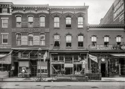 Washington, D.C., circa 1901. "View of F Street N.W., north side between 12th & 13th, showing various businesses." 5x7 inch glass negative, D.C. Street Survey Collection. View full size.