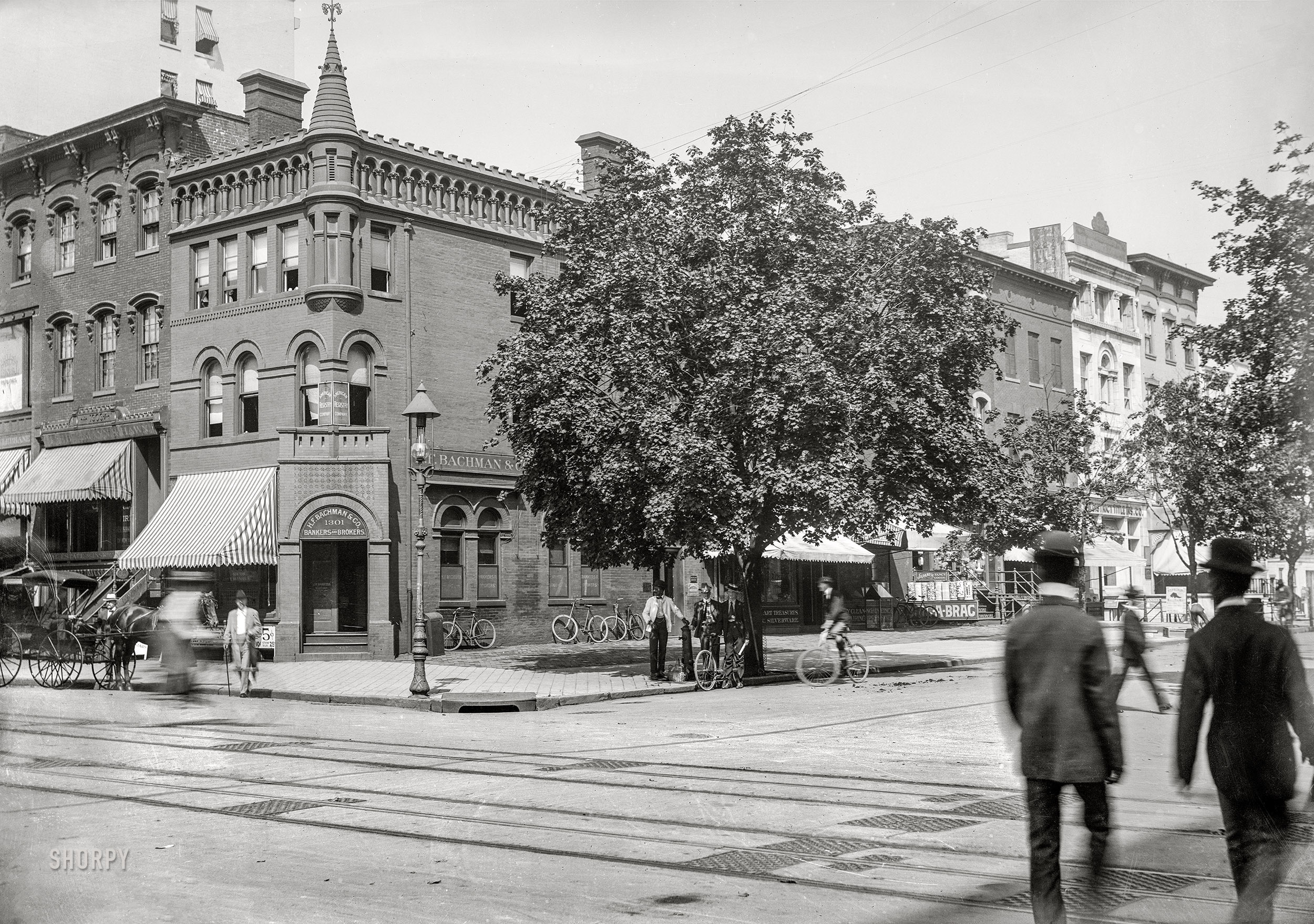 Washington, D.C., circa 1901. "View of 13th Street N.W., west side, looking north from F Street showing view of H.F. Bachman & Co. on the corner and other shops on the block." Which include a dealer in Japanese Fancy Goods and Bric-a-Brac. Also note the public water tap under the tree. 5x7 inch glass negative, D.C. Street Survey Collection. View full size.