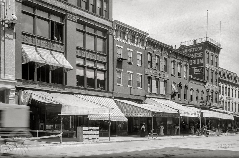 Washington, D.C., circa 1901. "Businesses on F Street N.W., north side, between 12th &amp; 13th Streets, Nos. 1201-1219." 5x7 glass negative, D.C. Street Survey Collection.  View full size.

