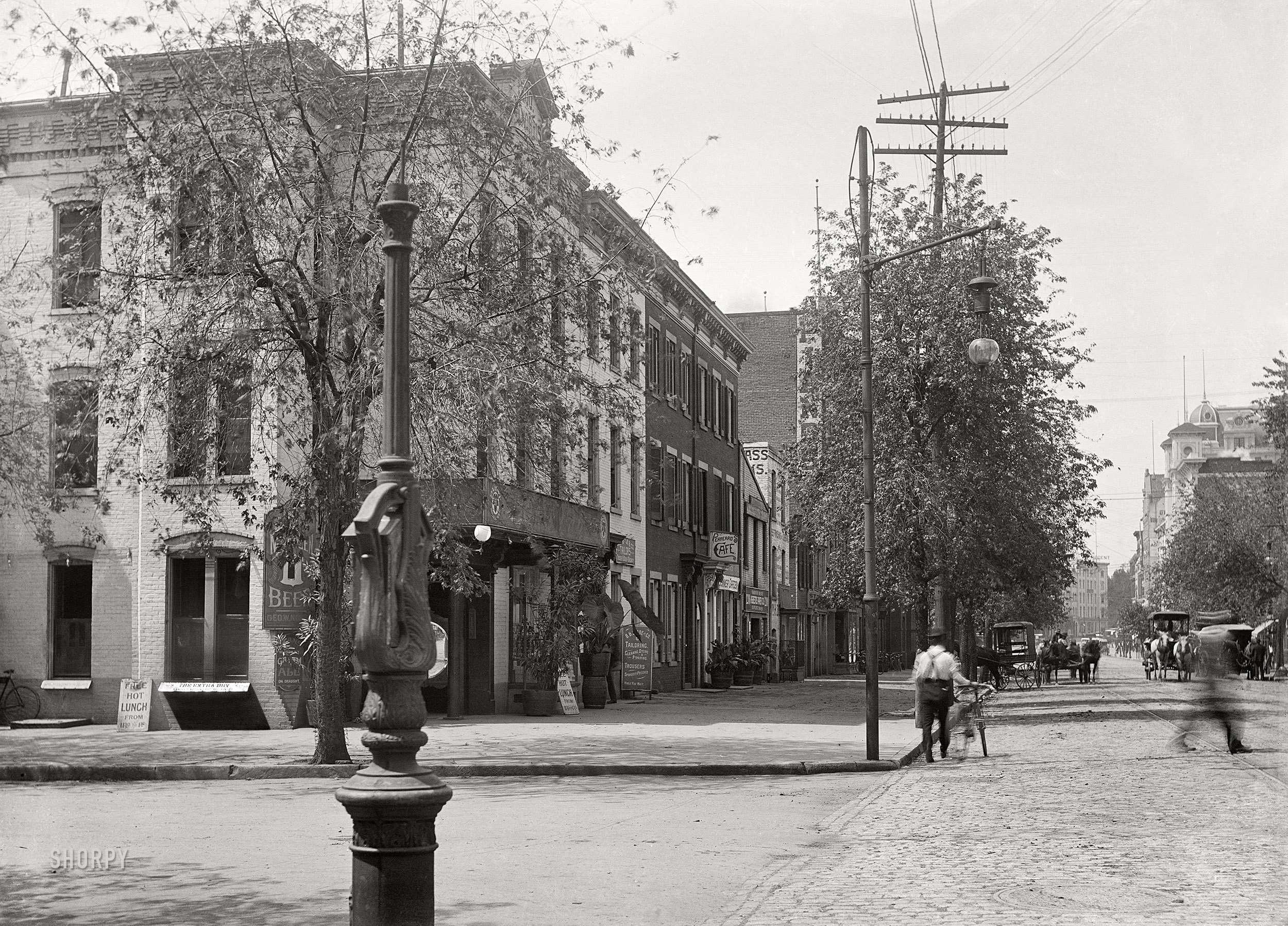 Washington, D.C., circa 1901. "View of E Street N.W., south side, looking west from 12th Street." 5x7 inch glass negative, D.C. Street Survey Collection.  View full size.