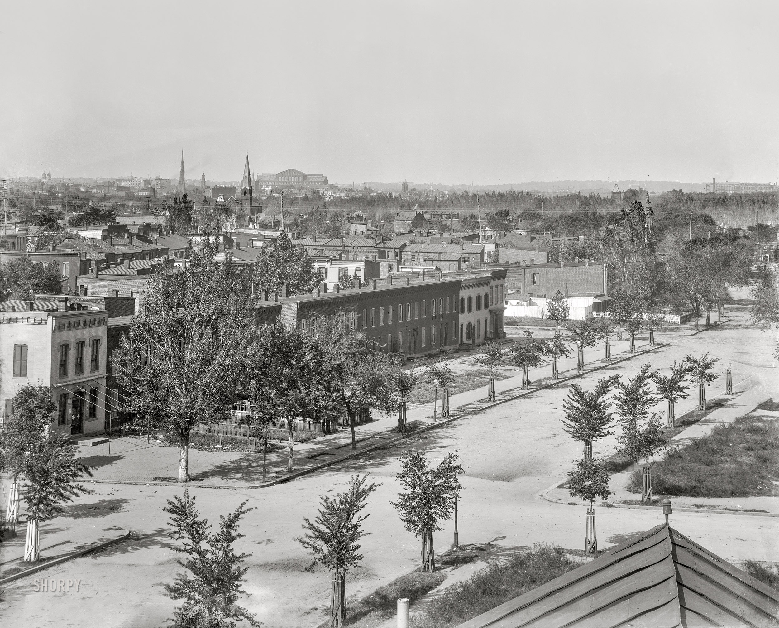 Washington, D.C., circa 1901. "An elevated view of Delaware Avenue S.W. between H & G streets from the Randall School." Large structure on the horizon is the Pension Office, now the National Building Museum. 8x10 glass negative, D.C. Street Survey Collection. View full size.