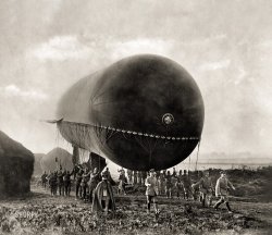 France circa 1915. "German tethered balloon being raised for observation purposes during the Champagne campaign (observation balloon being maneuvered through a field of haystacks by German soldiers in the Champagne region of France during World War I)." Gelatin silver print from the F.J.M. Rehse Archiv für Zeitgeschichte und Publizistik, München. View full size.