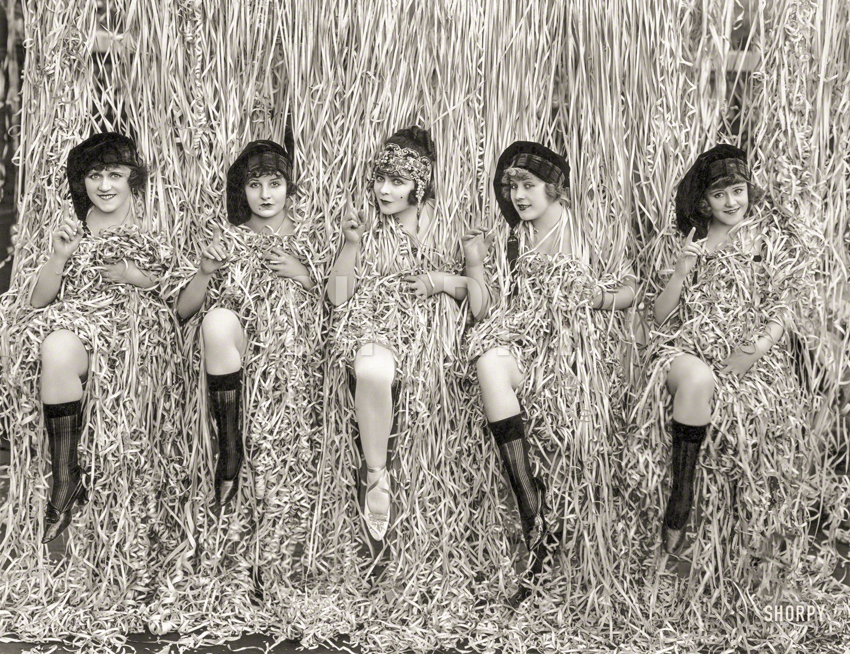 April 1918. "Five Mack Sennett girls provocatively posed amid serpentine confetti." Winners of the Shoscar® for Best Costume! Photo by Evans, L.A. View full size.