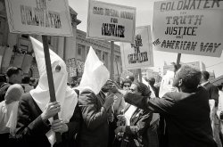 July 12, 1964. "Ku Klux Klan members supporting Barry Goldwater's campaign for the presidential nomination at the Republican National Convention, San Francisco, California, as an African American man pushes signs back." 35mm negative by Warren K. Leffler for U.S. News & World Report. View full size.