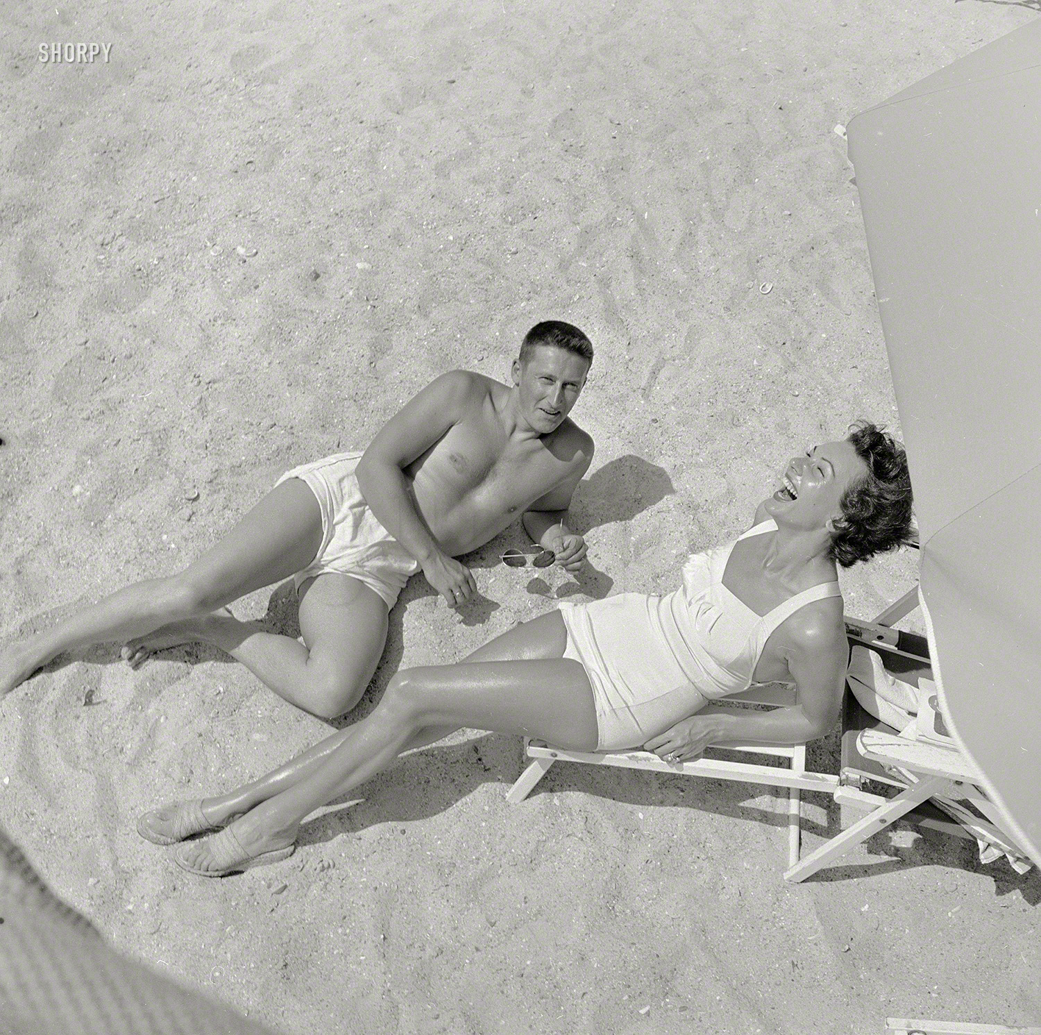 June 1953. "Activities at the Sun Fun Festival, Myrtle Beach, South Carolina. Mickey Spillane, one of the beauty pageant judges, on the beach with a woman." From photos by Jim Hansen for the Look magazine assignment "Behind the Scenes -- Beauty and the Beach." View full size.