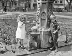 Washington, D.C., 1922. "Children at water fountain." Make mine a double, and get the little lady a drink. Harris & Ewing glass negative. View full size.