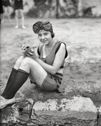 July 1922. Washington, D.C. "Snapped at the Tidal Basin: Mildred Kapleck with her pet opossum, the latest novelty introduced at the bathing beach." Harris & Ewing glass negative for The Washington Post. View full size.