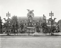 "Almas Welcomes A.A.O.N.M.S." The Washington, D.C., Masonic temple's hello to potentates of the Ancient Arabic Order of the Nobles of the Mystic Shrine during the Shriners convention of May 1923. 4x5 glass negative. View full size.