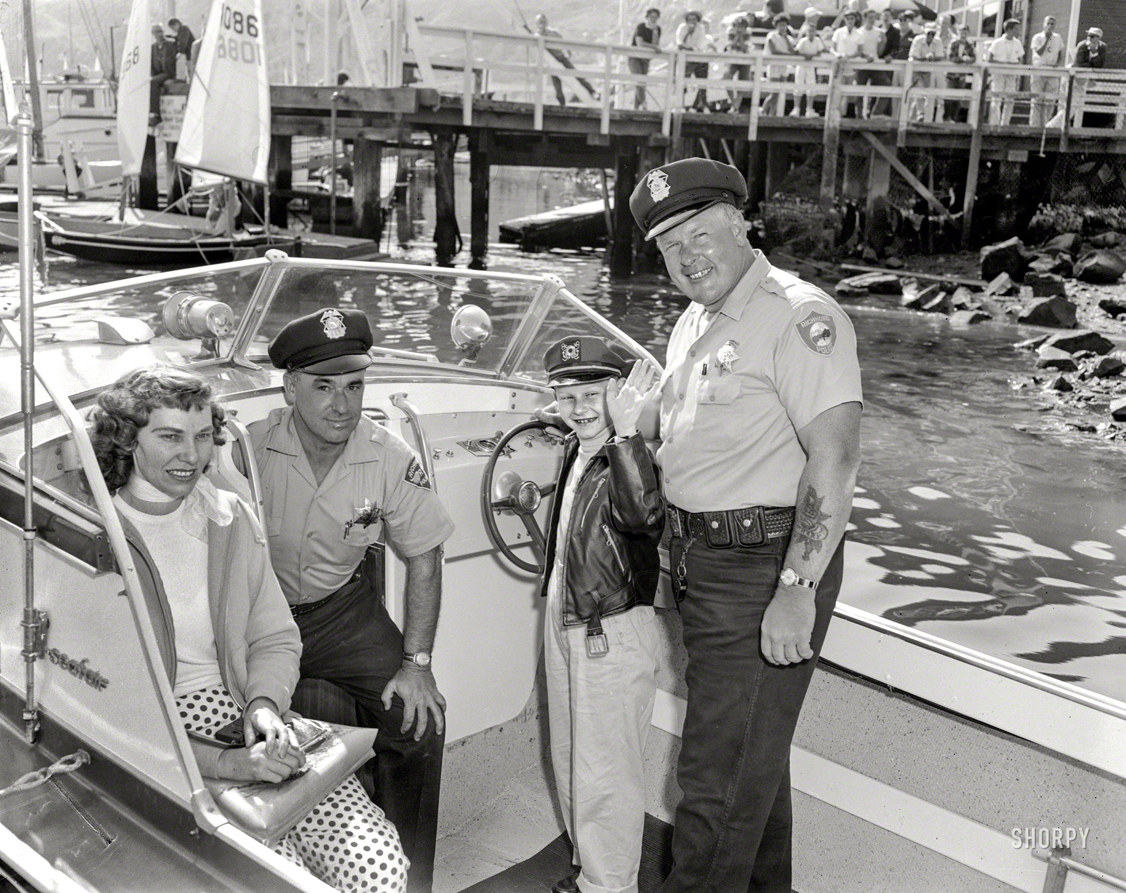 &nbsp; &nbsp; &nbsp; &nbsp; UPDATE: For the story behind this photo, click here and scroll down to the comments.
October 2, 1960. Richmond, California. "Harbor Patrol." Rickey Stowell helming a Glasspar Seafair. 4x5 inch acetate negative from the Shorpy News Photo Archive. View full size.