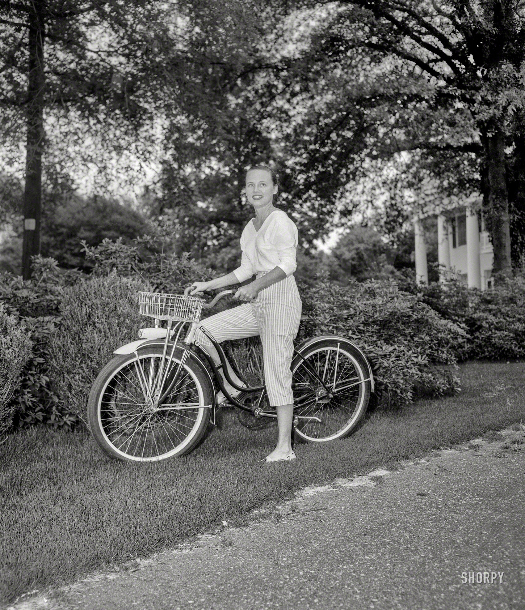 From somewhere around Columbus, Georgia, circa 1957 comes this unidentified lady on a Schwinn, pre-Spandex. 4x5 acetate negative. View full size.