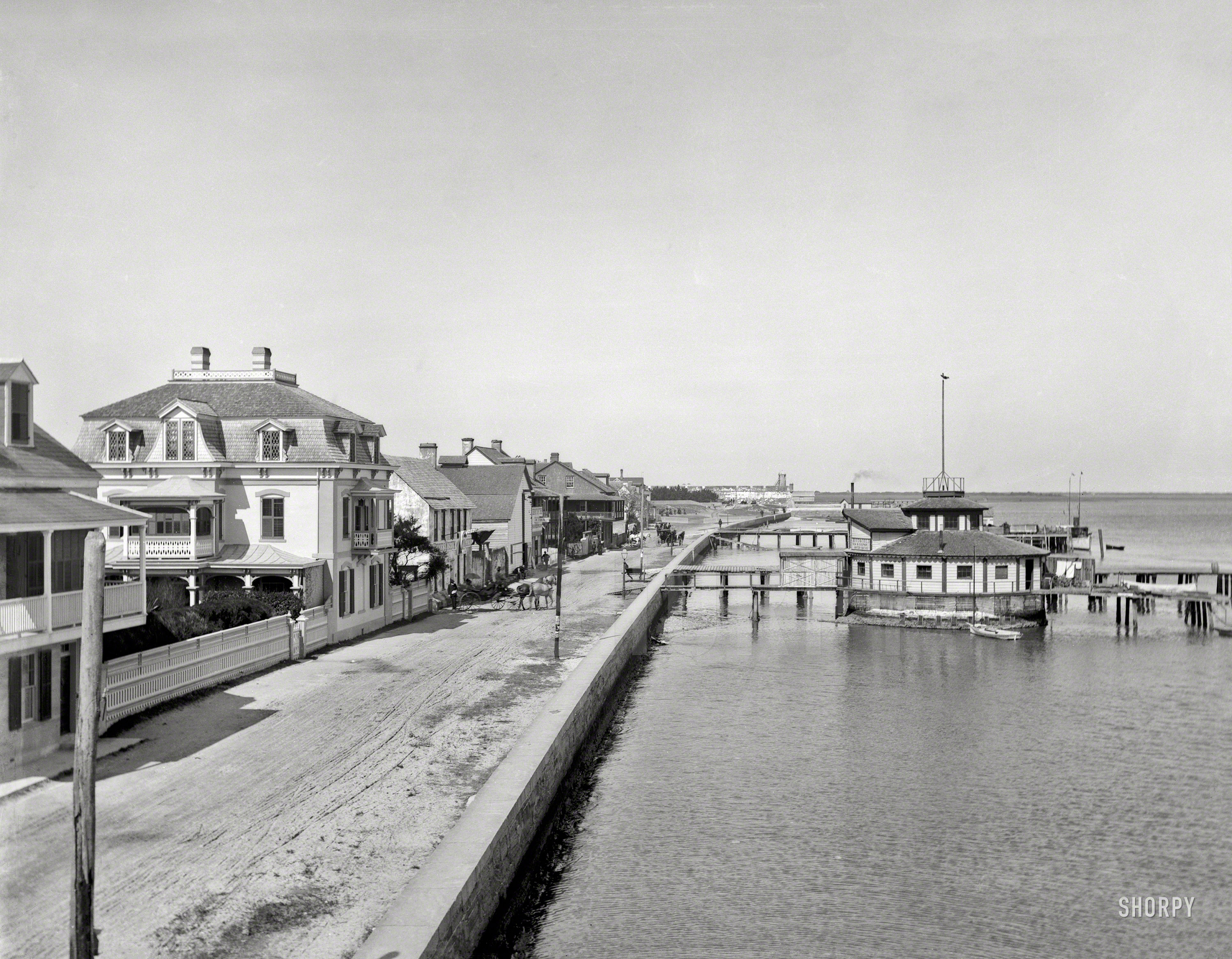 Circa 1897. "The sea wall at St. Augustine." Diversions include a "Museum and Menagerie" and "Hot & Cold Sea & Sulphur Water Baths." In the distance, the Castillo de San Marcos. Glass negative by William Henry Jackson. View full size.