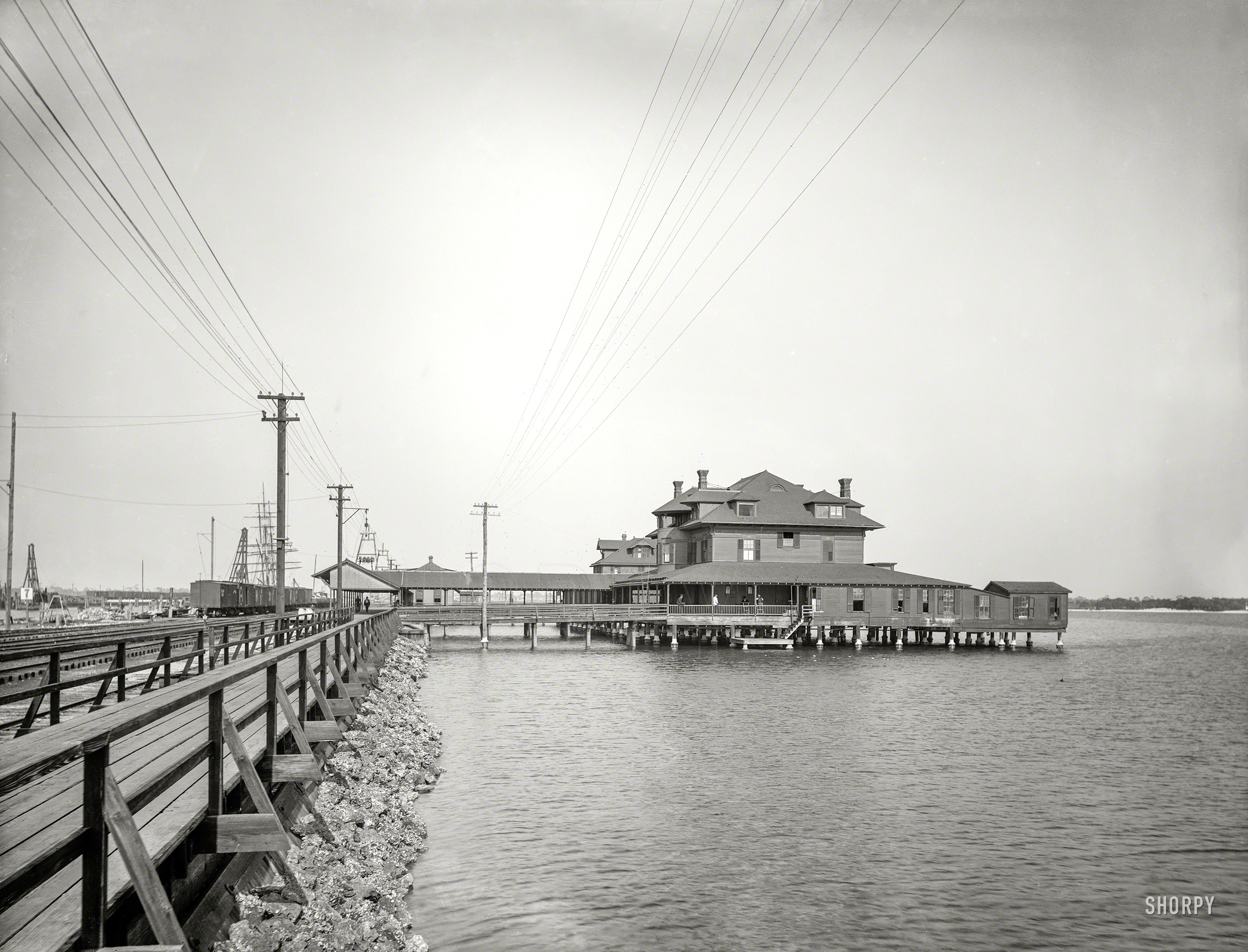 "Tampa Pier, Fla." The Port Tampa Inn, wharf and rail line circa 1898, captured on an 8x10 glass plate by William Henry Jackson. View full size.