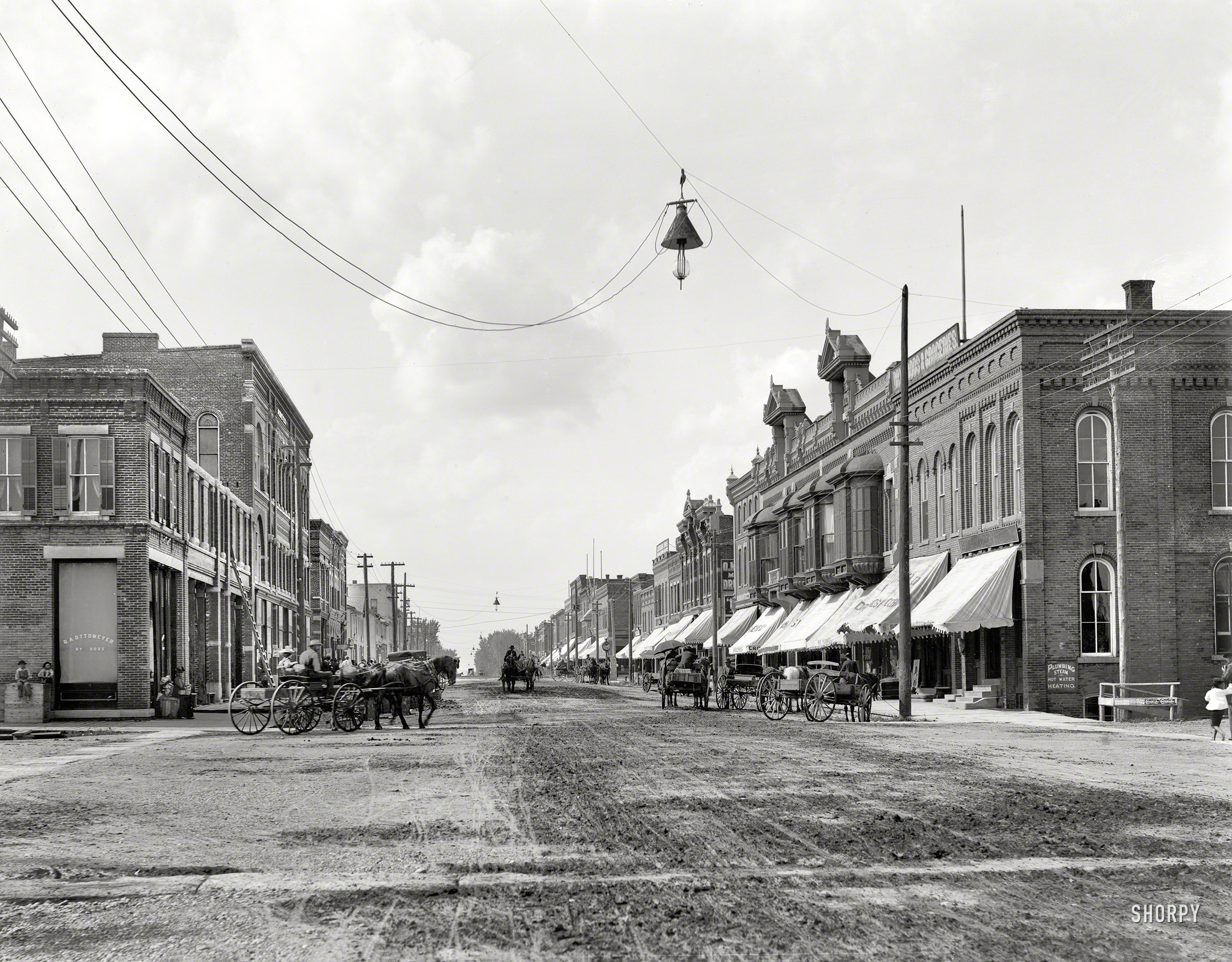 New Ulm, Minnesota, circa 1899. "Main Street." Showcasing the latest in electric illumination. 8x10 inch glass negative, Detroit Photographic Co. View full size.