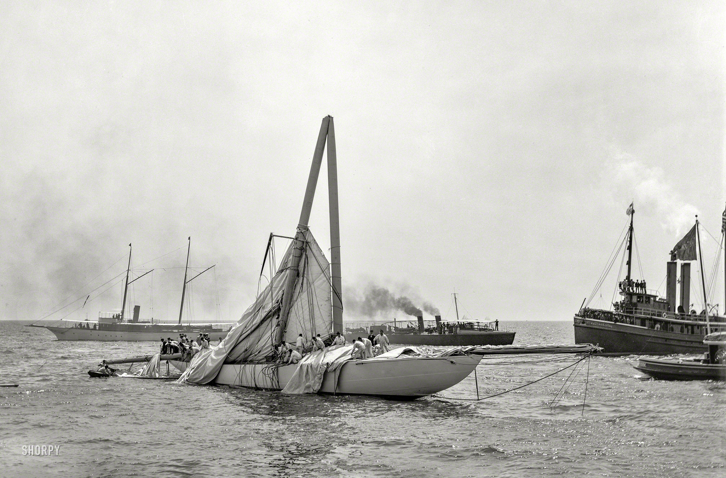 August 2, 1899. "Sloop Columbia, steel mast carried away." 8x10 inch glass negative by John S. Johnston, Detroit Photographic Company. View full size.