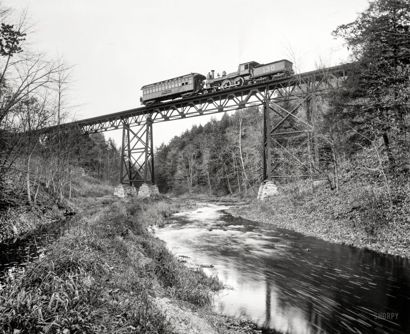 Circa 1900. "Detroit Photographic car crossing DL&amp;W bridge over the Passaic at Millington, New Jersey." 8x10 inch glass negative. View full size.
