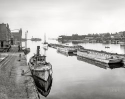 "Down the river -- Oswego, N.Y." Circa 1901, the steam tug Charley Ferris on the Oswego River. 8x10 inch dry plate glass negative, Detroit Photographic Company. View full size.