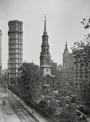 Manhattan circa 1901. "St. Paul's Chapel and St. Paul Building -- Vesey Street and Broadway, New York." 8x10 inch dry plate glass negative, Detroit Photographic Company. View full size.
How do you rest in peacein a city that never sleeps?
If I'm counting fence sections correctly, the building with Lofts To Let is still there; the three-bay Italianate with a parking garage entrance.  None of the buildings on the right are still there.  But the sliver of the building at far left is also still standing.
[Not to mention the Park Row Building, a very early contender for world's tallest. - Dave]

Skinny is as skinny doesThe St. Paul Building was an anticipation of today's skinny skyscrapers, the reductio ad absurdum of New York's tall-is-better-than-wide thinking.
(The Gallery, DPC, NYC)