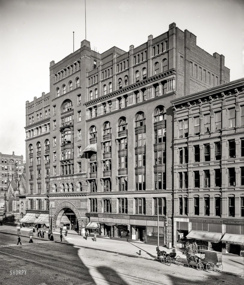 Cleveland, Ohio, circa 1900. "The Arcade Building, Superior Avenue." (Interior view here.) Ground-floor tenants include the Hat Box, Arcade Pants Parlors and, next door, a Misfit Clothing Parlor (a.k.a. Fitwell Clothing) and Chisholm's Boot Shop. 8x10 inch glass negative, Detroit Publishing Co. View full size.
