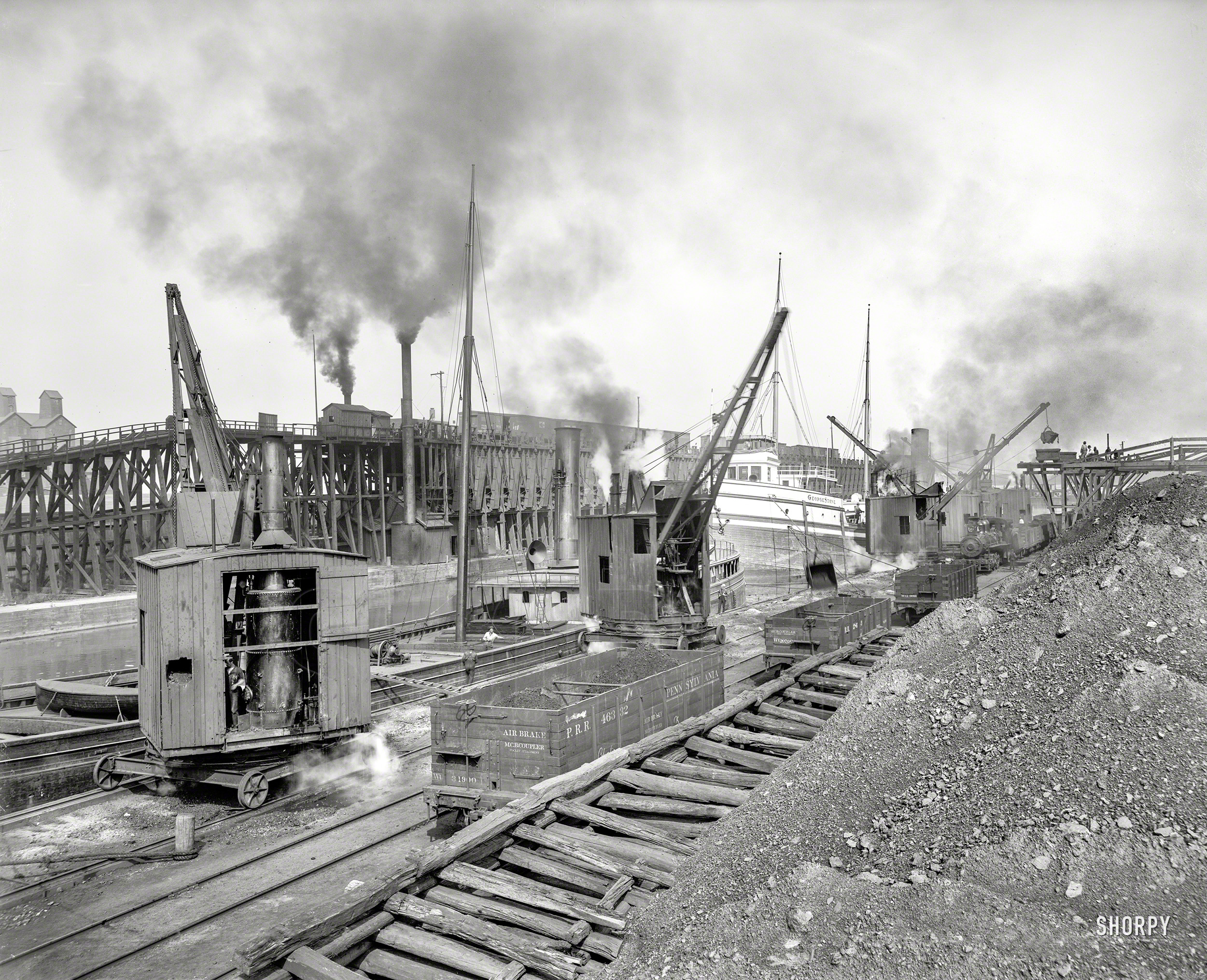 Circa 1900. "Whirleys unloading ore, Penna. R.R. docks, Erie, Pennsylvania." 8x10 inch dry plate glass negative, Detroit Publishing Company. View full size.