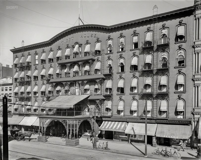 Buffalo, New York, circa 1900. "Tifft House, Main Street." Demolished 1902; home to Minehan's Hair Store (offering "a full line of switches, waves, fringes and wigs"). 8x10 inch glass negative, Detroit Photographic Company. View full size.
