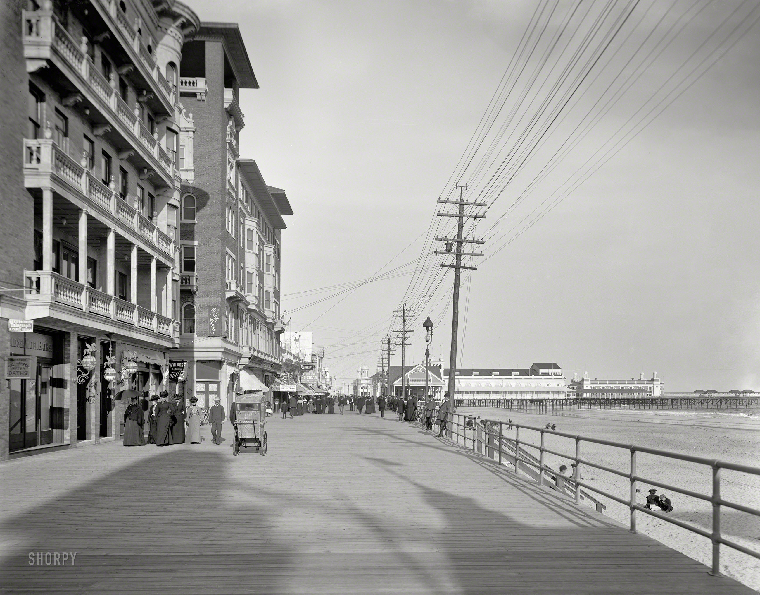 The Jersey Shore circa 1901. "The Boardwalk and Auditorium Pier, Atlantic City." At Ocean Avenue, George Coryell's Bleak House hotel. View full size.