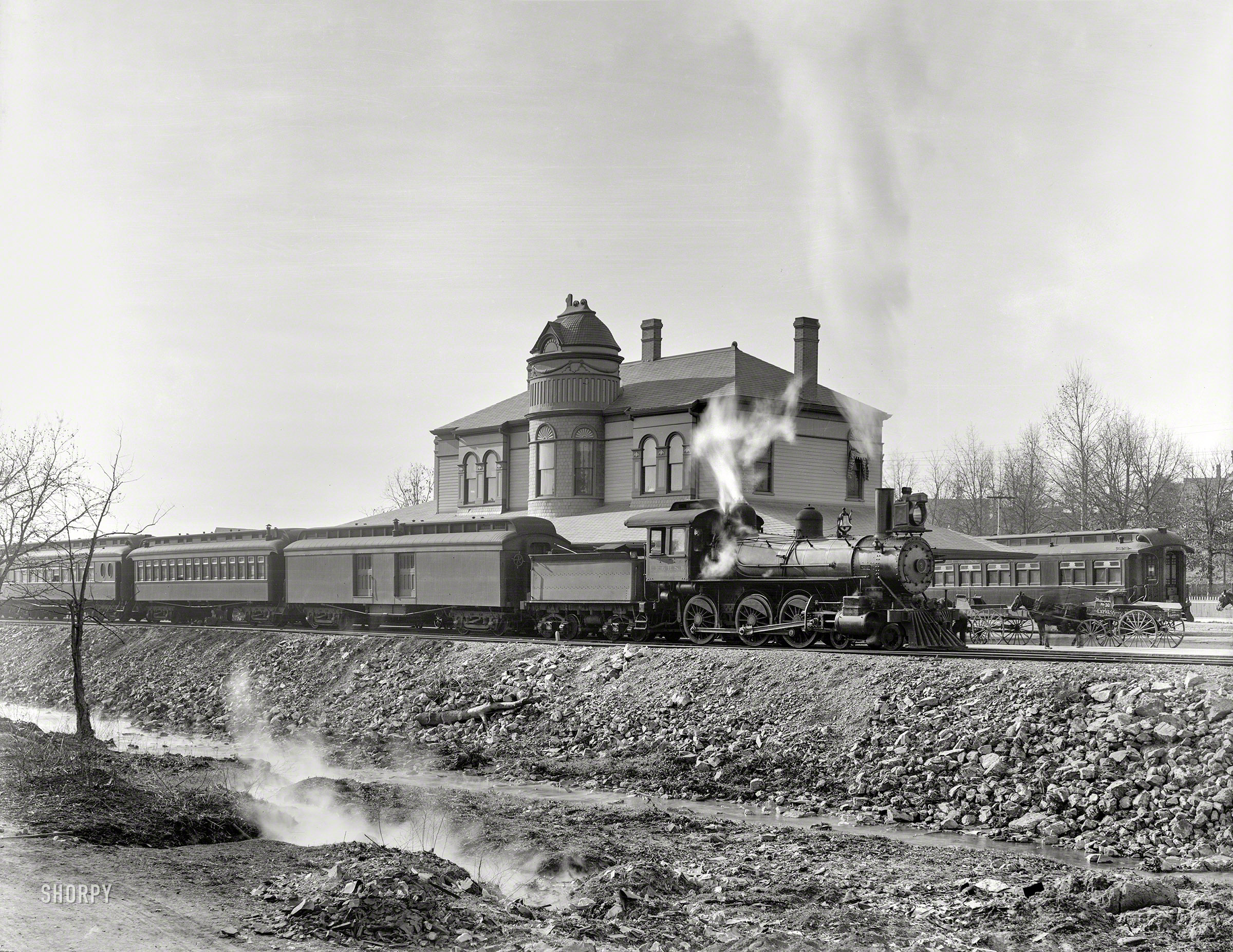 Circa 1900. "L.R. & H.S.W. R.R. Depot, Hot Springs, Arkansas." A locomotive of the Little Rock & Hot Springs Western Railroad. 8x10 inch dry plate glass negative, Detroit Photographic Company. View full size.