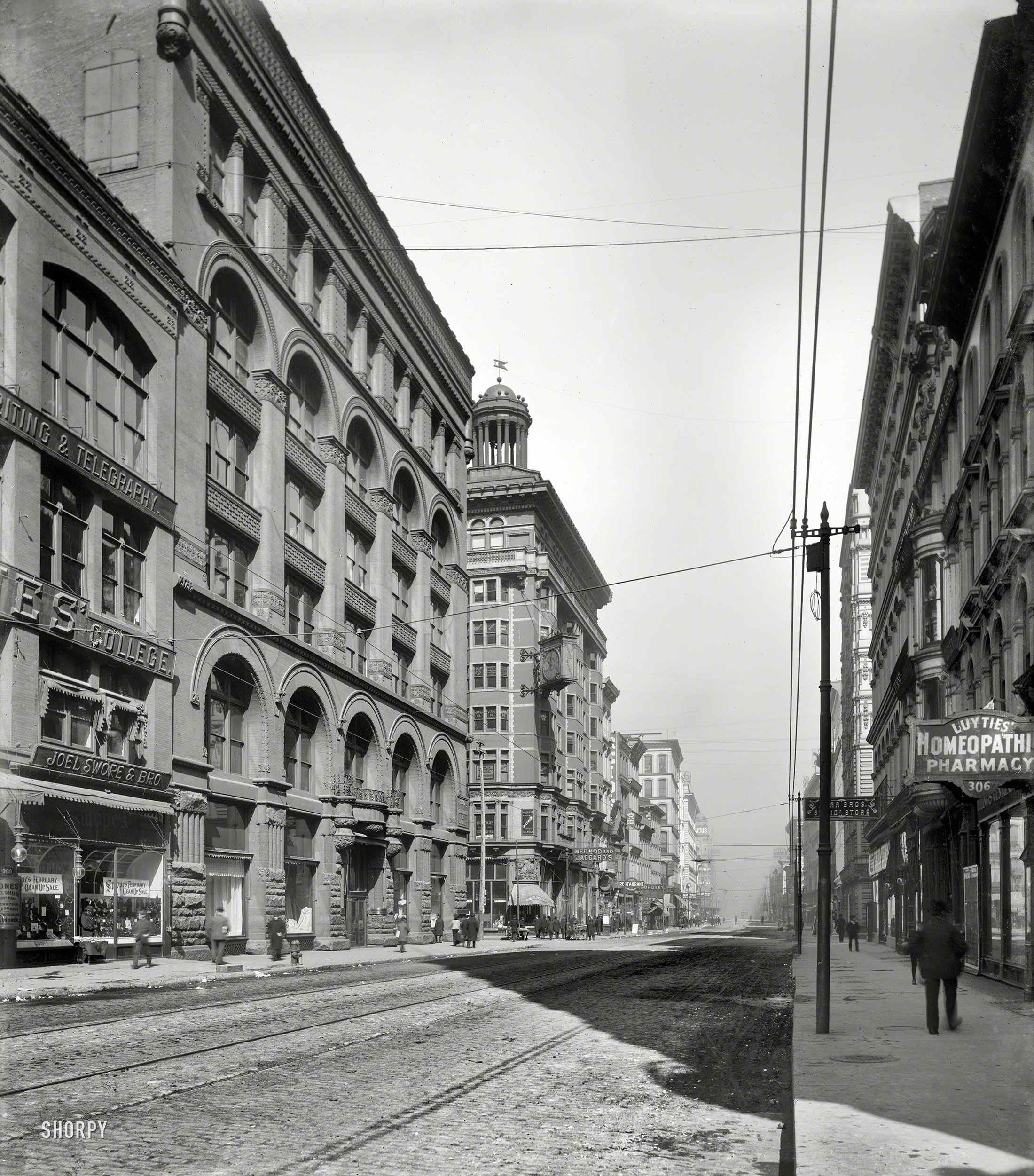 St. Louis, Missouri, circa 1900. "Broadway north from Olive Street." A nice view of the Homeopathic Pharmacy sign. 8x10 glass negative. View full size.